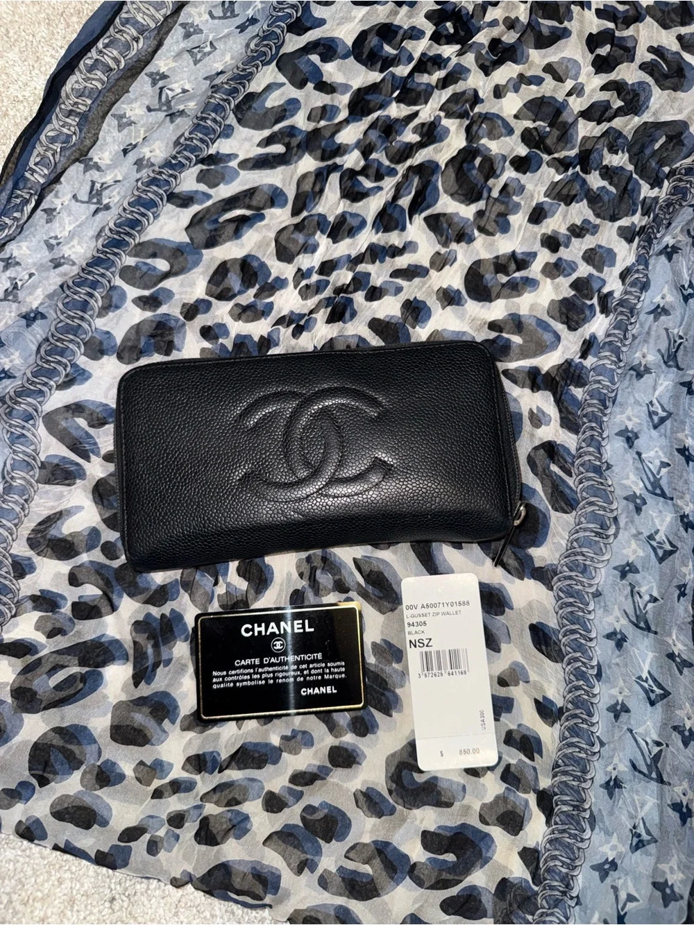 Authentic CHANEL Black Caviar Leather Zip-Around Wallet with Embossed CC